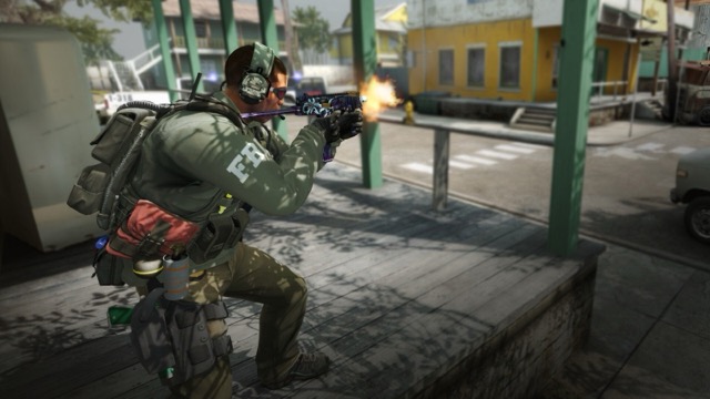 Counter-Terrorist firing an SMG in a street firefight in classic CS:GO